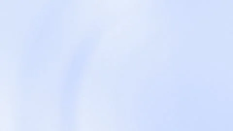 Seamless loop background of soft pale blue gradients and subtle arcs. 4K. Stock Footage 299397524