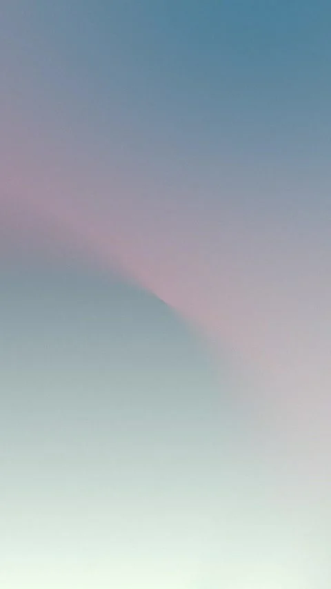 Seamless loop background in soft pastel hues of blue and pink gradient. 4K. Stock Footage 309956955