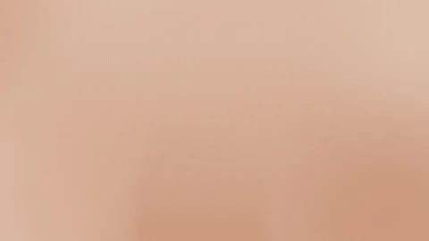 Seamless loop background in soft peach tones with subtle grid pattern, 4K. Stock Footage 297914946