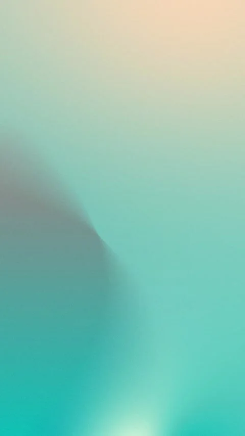 Seamless loop background with soft teal gradient merging into peach tones. Stockbeeldmateriaal 309701553