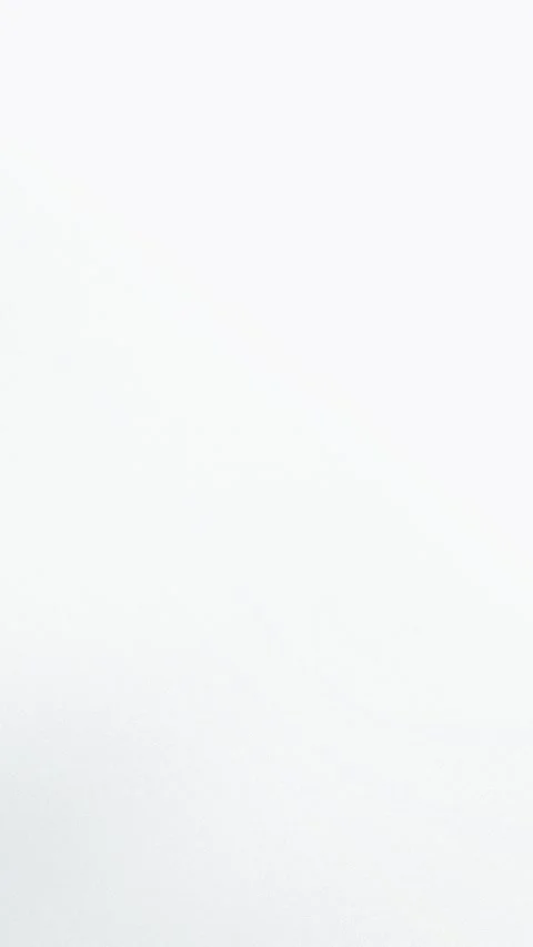 Seamless loop background with a soft white gradient. Minimalist design featuring Stock Footage 309956379