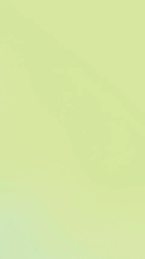 Seamless loop background in soft yellow-green gradient. 4K smooth abstract Vídeo Stock 309855889