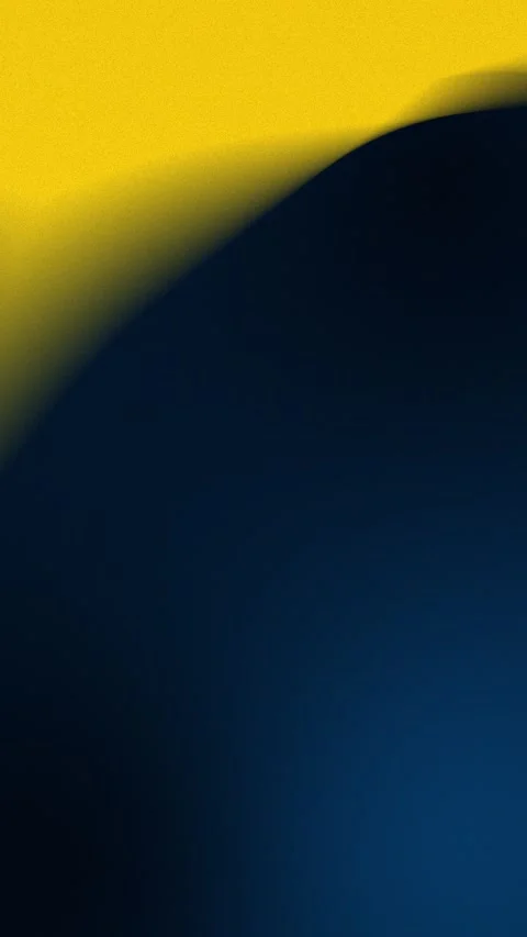 Seamless loop background with vibrant yellow and dark blue gradient shapes. 4K. 動画素材 309701355