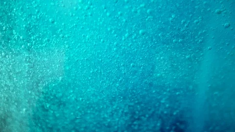Seamless loop blue background, tiny bubbles rise slowly through liquid Stock Footage 112664750