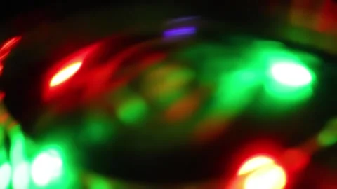 Seamless loop of blurred rotating colorful LED lights Video stock 141268899