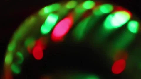 Seamless loop of blurred rotating colorful LED lights Stock Footage 141276551