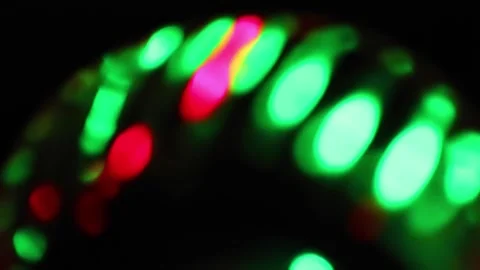 Seamless loop of blurred rotating colorful LED lights Stock Footage 141277024