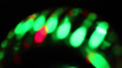 Seamless loop of blurred rotating colorful LED lights Stock Footage 141277493
