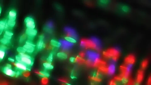 Seamless loop of blurred slowly tilting colorful LED lights Stock Footage 127369862