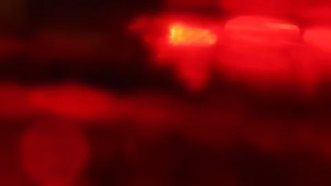 Seamless loop of blurred slowly tilting colorful LED lights Stock Footage 127781550