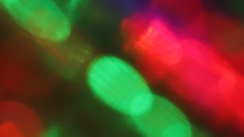 Seamless loop of blurred slowly tilting colorful LED lights Video stock 127781784