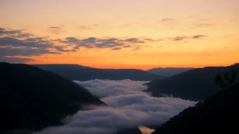 Seamless loop cinemagraph of mountains fog mist clouds in Grandview sunrise Stock Footage 130073093