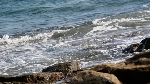 Seamless loop, Close up of waves crashing on rocks - Video HD Stock Footage 74872835