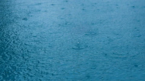 Seamless loop. closeup footage rain on water surface. Stock Footage 134028040