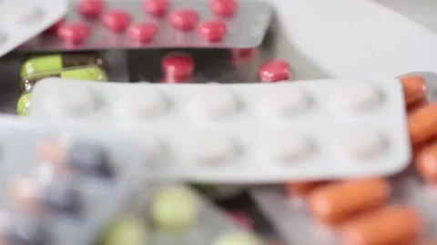 Seamless loop of closeup pile of colorful medicine in blisters Stock Footage 147200207