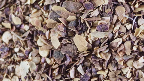 Seamless loop of crushed red pepper rotating close-up Stock Footage 344949202