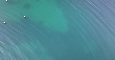 Seamless loop drone view of clear turquoise seawater surface Stock Footage 339670292