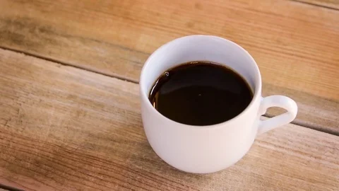 Seamless loop - Drop falling in a cup of coffee Video stock 73230406