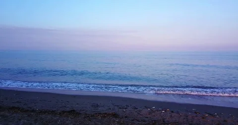 Seamless loop footage of an ocean wave at sunset 4k 002 Stock Footage 78377323
