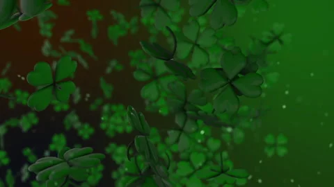 Seamless loop of green shamrocks and particles flying around Stock Footage 241594261