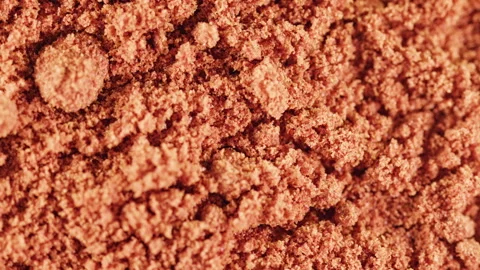 Seamless loop of ground paprika powder rotating close-up Stock Footage 344949704