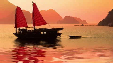 Seamless loop, Junk boat at sunset in Halong Bay, Vietnam Stock Footage 75638124