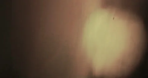 Seamless loop light gold warm rays on black background, light in the dark Stock Footage 277591441