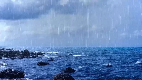 Seamless Loop Sea Waves And Heavy Rain On The Rocky Fishing Beach At The Village Stock Footage 101023969