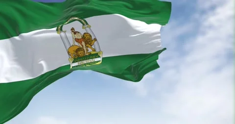 Seamless loop in slow motion with Andalusian flag waving in the wind Stock Footage 196879857