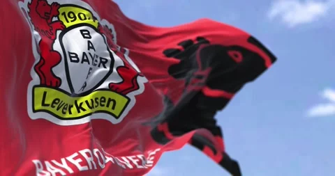 Seamless loop in slow motion of Bayer Leverkusen flag waving on a clear day Stock-Footage 240232648