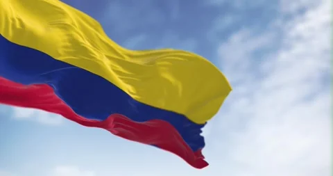 Seamless loop in slow motion of Colombia national flag waving in the wind Stock Footage 245286632