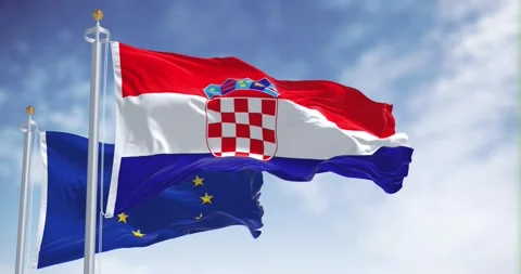 Seamless loop in slow motion of Croatia and the EU flag waving on a clear day Stock Footage 242493107