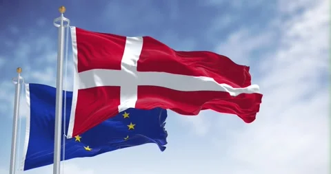Seamless loop in slow motion of Denmark and the EU flags waving on a clear da Stock Footage 243275500