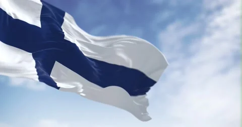 Seamless loop in slow motion of Finland national flag waving on a clear day Stock Footage 239639357
