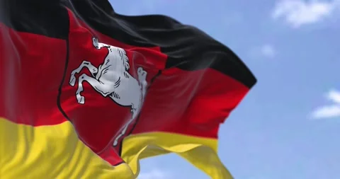 Seamless loop in slow motion with the flag of Lower Saxony waving in the wind Stock Footage 196184428
