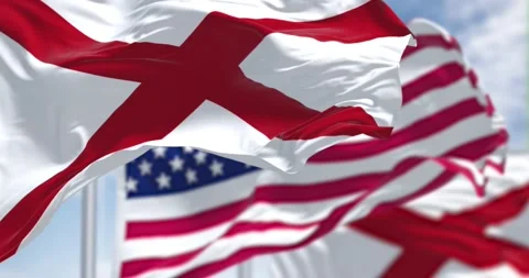 Seamless loop in slow motion with the flags of the Alabama state and US Video stock 196011013