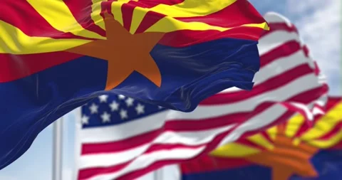 Seamless loop in slow motion with the flags of the Arizona state and US Stock Footage 196011123