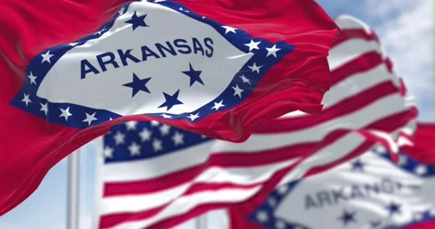 Seamless loop in slow motion with the flags of the Arkansas state and US Stock-Footage 196011335