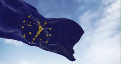 Seamless loop in slow motion of Indiana state flag waving on a clear day. Stock Footage 243090791