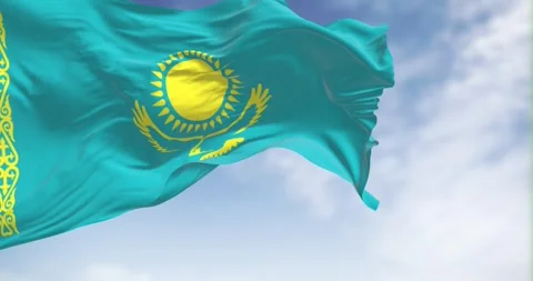 Seamless loop in slow motion of Kazakhstan flag waving on a clear day Stock Footage 240414136