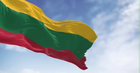 Seamless loop in slow motion of Lithuania flag waving on a clear day. Video stock 243275931