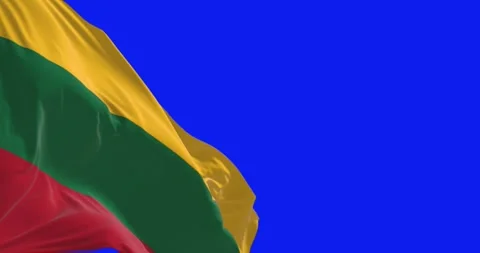 Seamless loop in slow motion of Lithuania flag waving in the wind on blue s.. Stock Footage 245485698