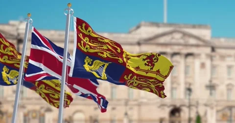 Seamless loop in slow motion of the Royal Standard and UK flags waving in L.. Stock Footage 237514252