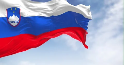Seamless loop in slow motion of Slovenia national flag waving on a clear day Stock-Footage 242159557