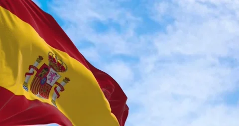 Seamless loop in slow motion of Spain national flag waving in a clear day Stock Footage 238826497