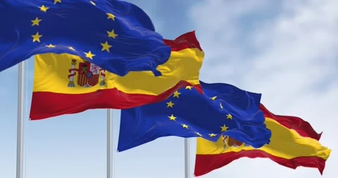 Seamless loop in slow motion of Spain and European Union flags waving Stock Footage 242159588