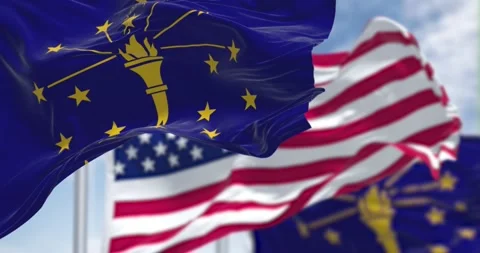Seamless loop in slow motion with two Indiana state flags waving with US flag Stock Footage 196723893