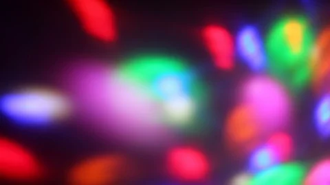 Seamless loop of soft focused spinning LED lights Video stock 85681412