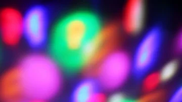 Seamless loop of soft focused spinning LED lights Video stock 85681849