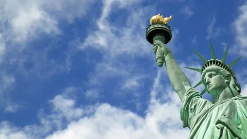 Seamless loop - Statue of liberty, blue sky with moving clouds Stock Footage 73230519